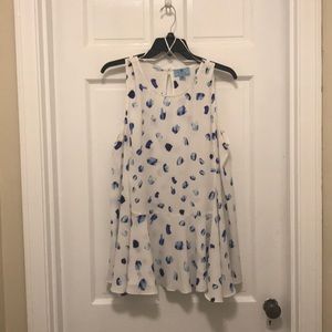 Sleeveless white top w/ blue “watercolor” detail